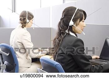 Stock Photo - young women working 
in call center. 
fotosearch - search 
stock photos, 
pictures, images, 
and photo clipart