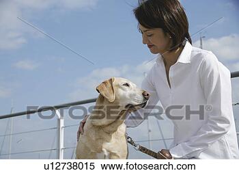 Stock Image - young woman and 
labrador retriever. 
fotosearch - search 
stock photos, 
pictures, images, 
and photo clipart