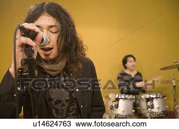 Stock Photo - rock band in rehearsal. 
fotosearch - search 
stock photos, 
pictures, images, 
and photo clipart