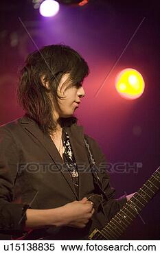 Stock Image - young man playing 
electric guitar 
on stage. fotosearch 
- search stock 
photos, pictures, 
images, and photo 
clipart