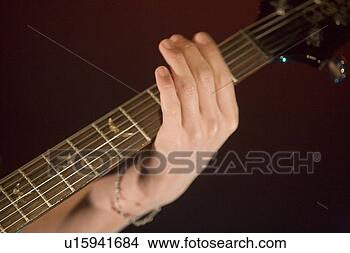 Stock Photo - young man playing 
electric guitar 
on stage. fotosearch 
- search stock 
photos, pictures, 
images, and photo 
clipart