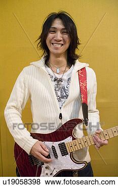 Stock Photo - young man playing 
electric guitar. 
fotosearch - search 
stock photos, 
pictures, images, 
and photo clipart