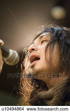 Stock Photo - young man singing. 
fotosearch - search 
stock photos, 
pictures, images, 
and photo clipart