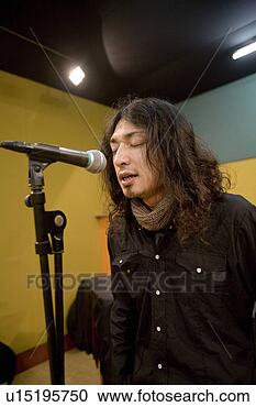 Stock Photography - young man singing. 
fotosearch - search 
stock photos, 
pictures, images, 
and photo clipart