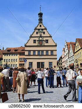 Stock Photography - large group of 
people watching 
clock tower in 
rothenburg, germany. 
fotosearch - search 
stock photos, 
pictures, images, 
and photo clipart