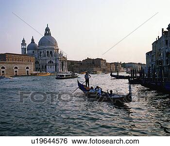 Stock Photo - tourists riding 
in gondola, venice, 
italy. fotosearch 
- search stock 
photos, pictures, 
images, and photo 
clipart