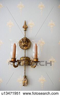 Stock Photography - candles hanging 
in candelabra 
on wall. fotosearch 
- search stock 
photos, pictures, 
images, and photo 
clipart