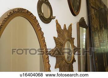 Stock Photo - collection of 
unique mirrors 
on wall. fotosearch 
- search stock 
photos, pictures, 
images, and photo 
clipart