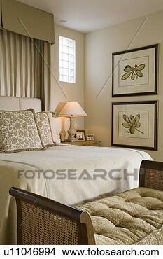 Stock Photo - detail of bed 
end bench with 
bed, lamp and 
pictures. fotosearch 
- search stock 
photos, pictures, 
images, and photo 
clipart