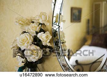 Stock Photography - detail of with 
white roses next 
to antique vanity 
mirror. fotosearch 
- search stock 
photos, pictures, 
images, and photo 
clipart