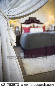 Stock Photo - knotted rope and 
tassles holding 
white curtain 
open. fotosearch 
- search stock 
photos, pictures, 
images, and photo 
clipart