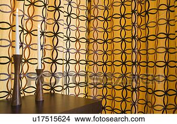 Stock Photo - patterned curtain 
and candles. fotosearch 
- search stock 
photos, pictures, 
images, and photo 
clipart