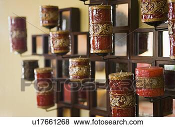 Stock Photo - red candles in 
holder on wall. 
fotosearch - search 
stock photos, 
pictures, images, 
and photo clipart