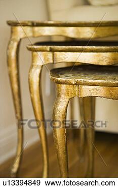 Stock Photograph - stack of gold 
side tables. fotosearch 
- search stock 
photos, pictures, 
images, and photo 
clipart