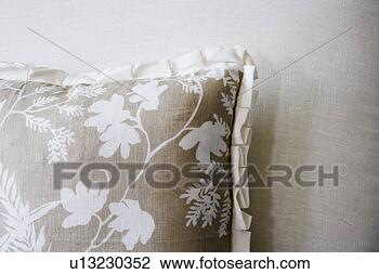 Stock Photo - tan flowered pillow 
on sofa. fotosearch 
- search stock 
photos, pictures, 
images, and photo 
clipart