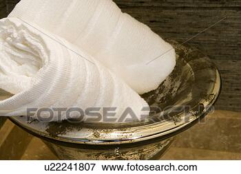 Picture - towel display 
in gold bowl. 
fotosearch - search 
stock photos, 
pictures, images, 
and photo clipart