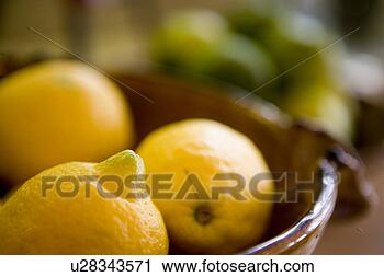 Stock Photography - detail of bowls 
with lemons and 
soft focused limes. 
fotosearch - search 
stock photos, 
pictures, images, 
and photo clipart