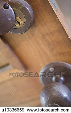 Stock Photograph - detail of iron 
door knob and 
lock, close up. 
fotosearch - search 
stock photos, 
pictures, images, 
and photo clipart