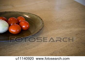 Stock Photography - detail of tomatoes 
and onion on plate. 
fotosearch - search 
stock photos, 
pictures, images, 
and photo clipart