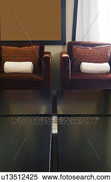 Stock Image - detail of two 
arm chairs with 
coffee table. 
fotosearch - search 
stock photos, 
pictures, images, 
and photo clipart