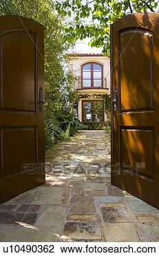 Stock Photo - front gate open 
to home courtyard. 
fotosearch - search 
stock photos, 
pictures, images, 
and photo clipart