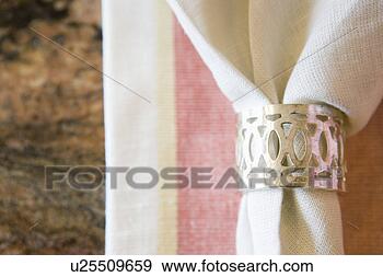 Stock Photograph - place setting 
with napkin with 
napkin ring, close 
up. fotosearch 
- search stock 
photos, pictures, 
images, and photo 
clipart