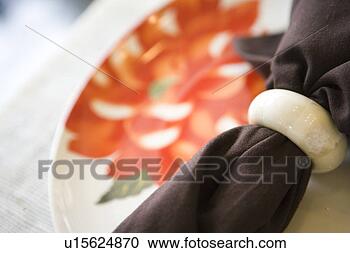 Stock Photography - place setting 
with plate, napkin, 
and napkin ring. 
fotosearch - search 
stock photos, 
pictures, images, 
and photo clipart