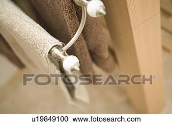 Stock Photography - two towels hanging 
on a towel rack, 
high angle, close 
up. fotosearch 
- search stock 
photos, pictures, 
images, and photo 
clipart