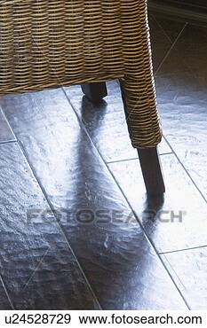 Stock Photograph - wicker chair on 
hardwood floor. 
fotosearch - search 
stock photos, 
pictures, images, 
and photo clipart