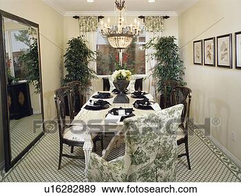 Stock Photograph - elegant green 
dining room with 
black place settings. 
fotosearch - search 
stock photos, 
pictures, images, 
and photo clipart