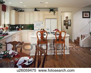 Stock Image - traditional kitchen 
with island and 
dining table. 
fotosearch - search 
stock photos, 
pictures, images, 
and photo clipart