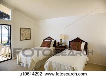 Stock Photo - twin beds with 
ornate wood headboards. 
fotosearch - search 
stock photos, 
pictures, images, 
and photo clipart