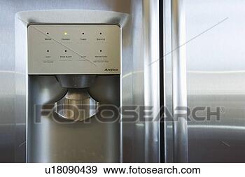 Stock Photograph - detail of refrigerator 
door with wtaer 
and ice dispenser. 
fotosearch - search 
stock photos, 
pictures, images, 
and photo clipart