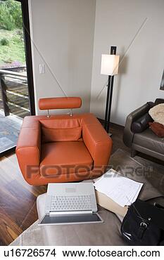 Stock Photo - laptop and modern 
orange leather 
armchair. fotosearch 
- search stock 
photos, pictures, 
images, and photo 
clipart