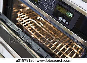 Stock Photo - open oven with 
digital clock. 
fotosearch - search 
stock photos, 
pictures, images, 
and photo clipart