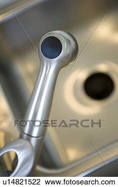 Stock Photo - stainless steel 
kitchen faucet, 
close up, high 
angle. fotosearch 
- search stock 
photos, pictures, 
images, and photo 
clipart