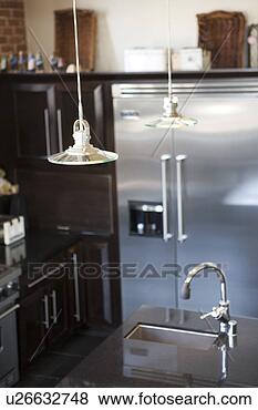 Stock Photo - vignette of lights 
over modern kitchen. 
fotosearch - search 
stock photos, 
pictures, images, 
and photo clipart