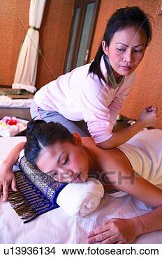 Stock Photo - masseuse using 
elbow to for pressure 
point massage. 
fotosearch - search 
stock photos, 
pictures, images, 
and photo clipart
