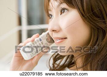 Stock Image - woman talking 
on cell phone. 
fotosearch - search 
stock photos, 
pictures, images, 
and photo clipart