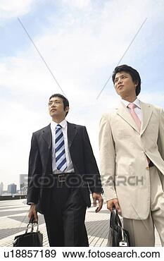 Stock Photograph - businessmen and 
blue sky. fotosearch 
- search stock 
photos, pictures, 
images, and photo 
clipart