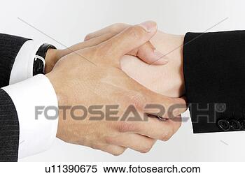 Stock Image - hand of a businessman 
shaking hands. 
fotosearch - search 
stock photos, 
pictures, images, 
and photo clipart