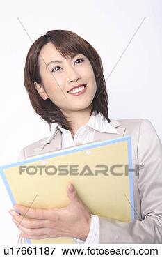 Picture - business lady 
with a clipboard. 
fotosearch - search 
stock photos, 
pictures, images, 
and photo clipart