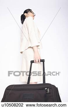 Stock Photo - business lady 
pulling a carry 
bag. fotosearch 
- search stock 
photos, pictures, 
images, and photo 
clipart