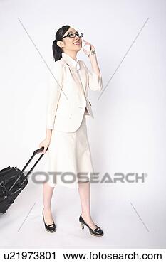 Stock Photography - business lady 
pulling a carry 
bag. fotosearch 
- search stock 
photos, pictures, 
images, and photo 
clipart