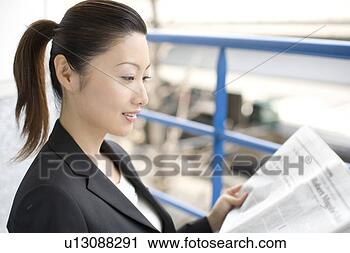 Stock Photography - business lady 
who reads a newspaper. 
fotosearch - search 
stock photos, 
pictures, images, 
and photo clipart