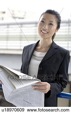 Stock Photograph - business lady 
who reads a newspaper. 
fotosearch - search 
stock photos, 
pictures, images, 
and photo clipart
