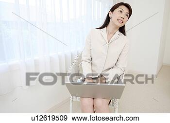 Stock Photograph - woman operating 
a pc. fotosearch 
- search stock 
photos, pictures, 
images, and photo 
clipart