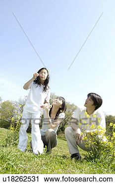 Stock Photography - family on the 
grassland. fotosearch 
- search stock 
photos, pictures, 
images, and photo 
clipart