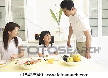 Stock Photograph - parent and child 
eating a meal. 
fotosearch - search 
stock photos, 
pictures, images, 
and photo clipart