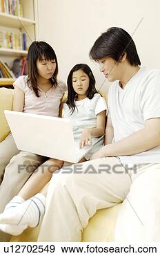 Stock Photograph - parent and child 
operating a pc. 
fotosearch - search 
stock photos, 
pictures, images, 
and photo clipart